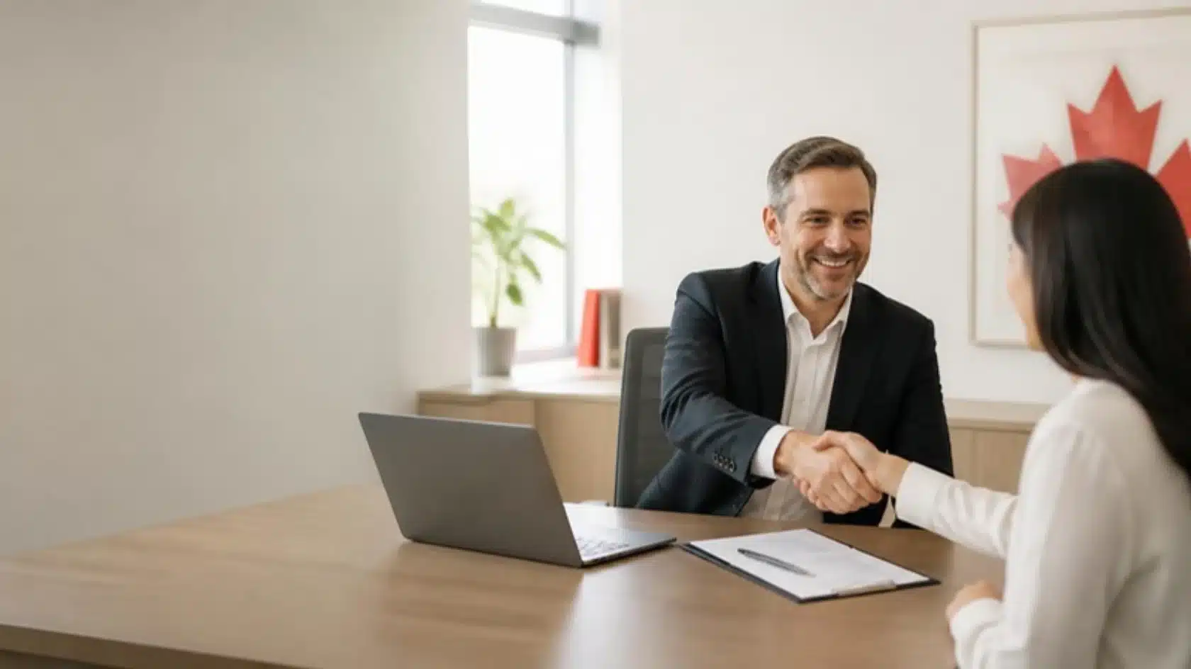 Employer and candidate reviewing a genuine job offer for Express Entry